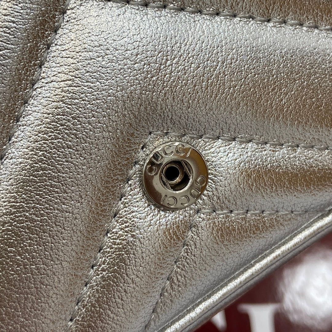 ** Gucci GG Marmont Super Mini Handbag - Silver Metallic Leather

**